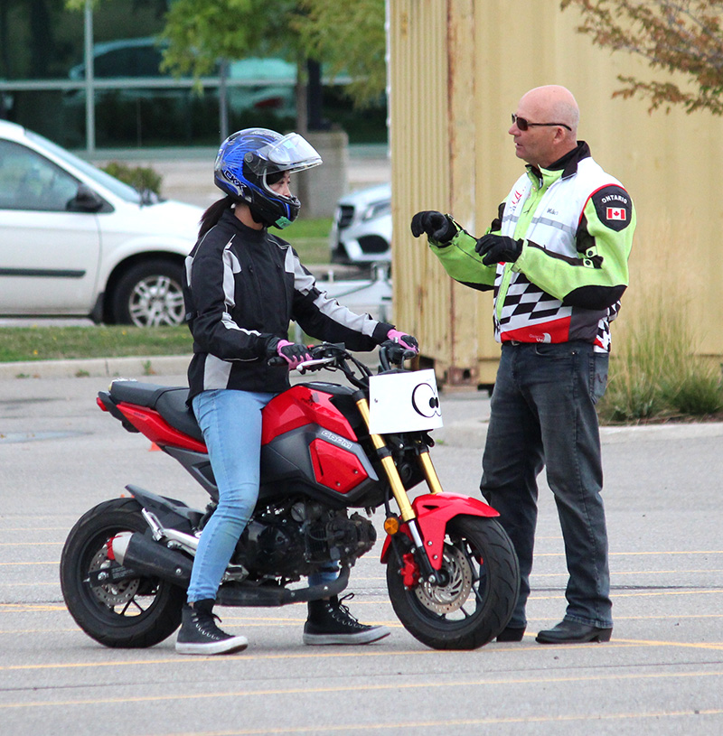 Instructor giving a student some riding tips